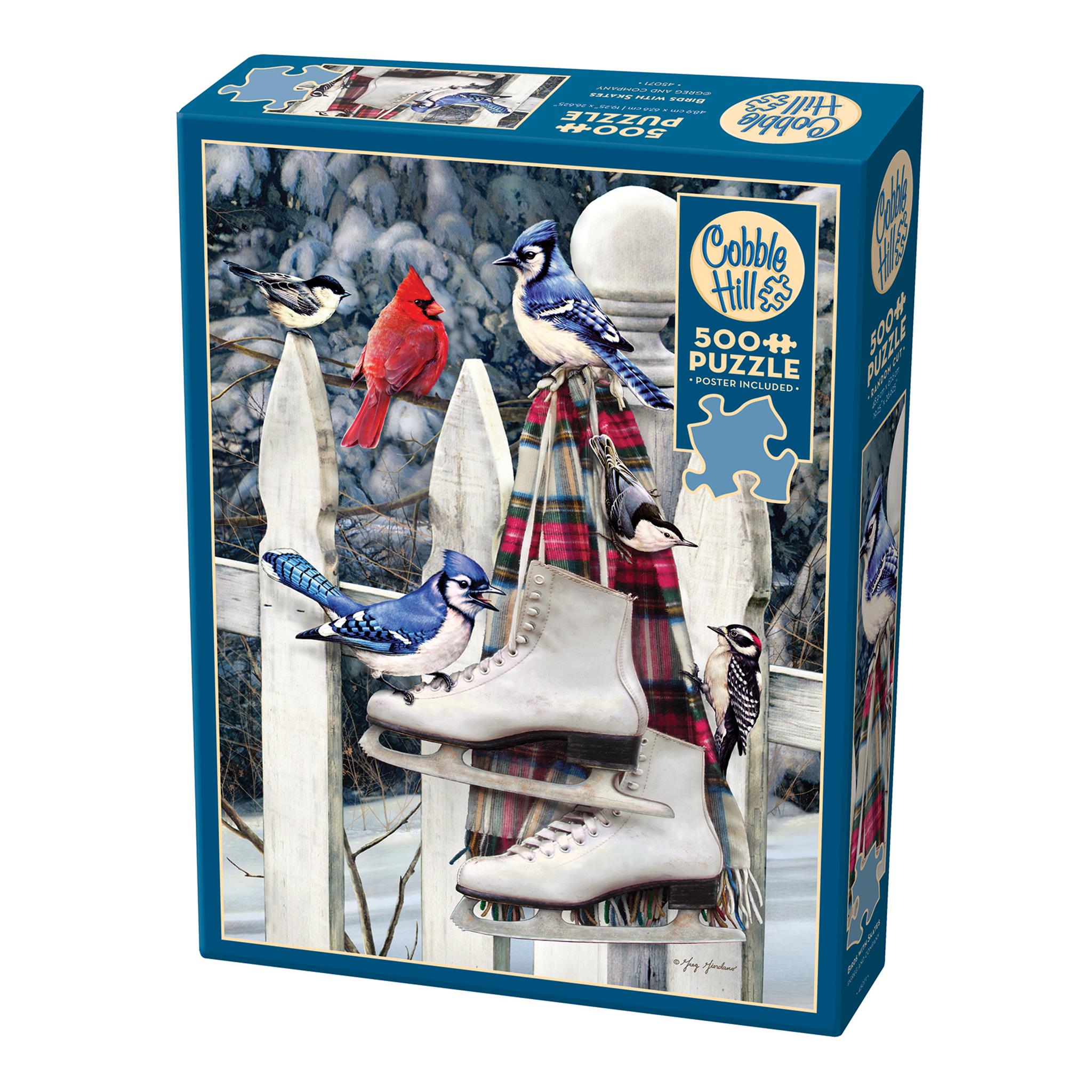 A 500 piece Cobble Hill jigsaw puzzle box featuring an illustration of birds, ice skates, and a scarf on a white picket fence.