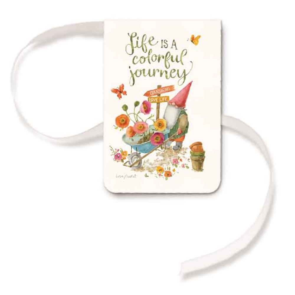 A magnetic bookmark with a ribbon, featuring an illustration of a character and floral elements, with the text 'Life is a colorful journey'.