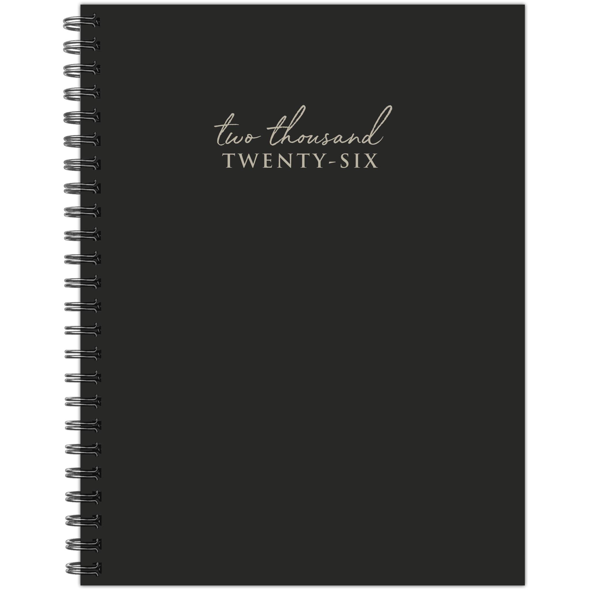flat black spiral bound planner with the text two thousand spelled in cursive and twenty six in cap block styled font