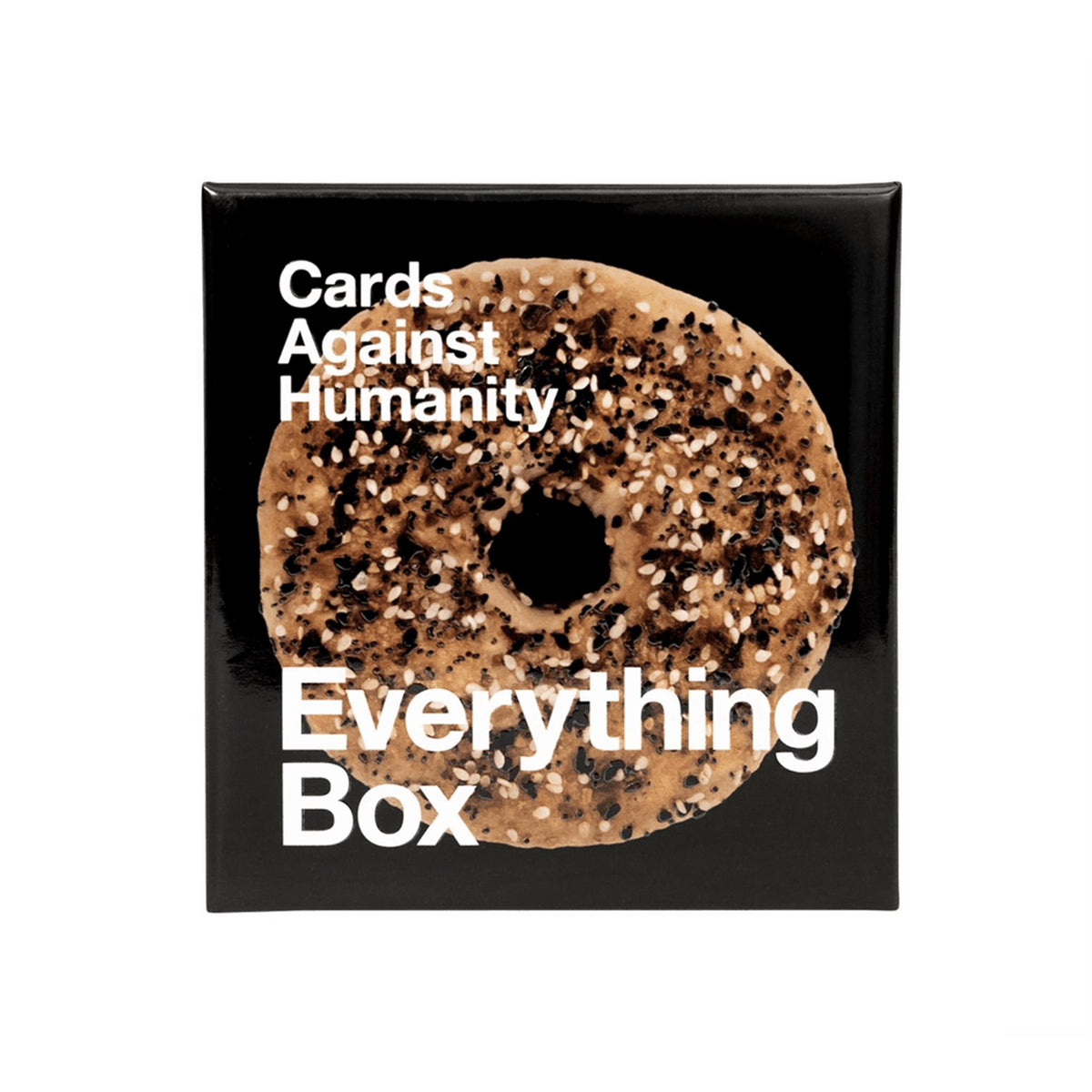 A box of 'Everything Box' Cards Against Humanity with an image of a bagel on the cover.