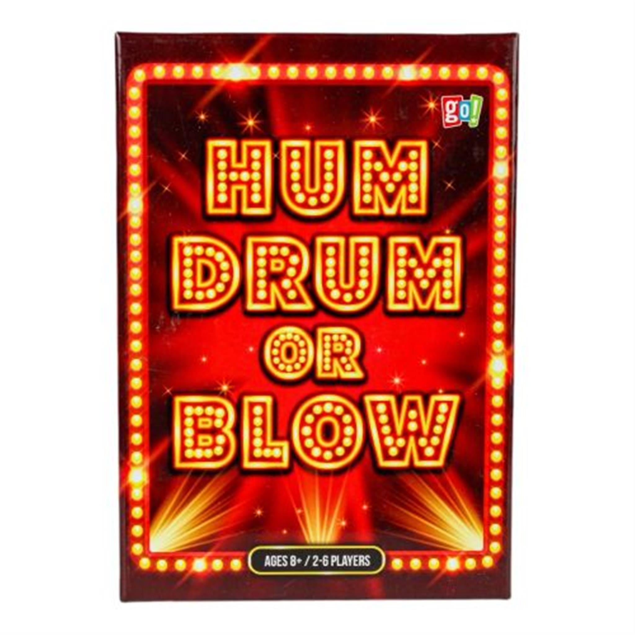 A board game box with 'HUM DRUM OR BLOW' written in bold, red letters on a background with confetti and lights, indicating it is designed for 2-6 players and recommended for ages 8 and up.