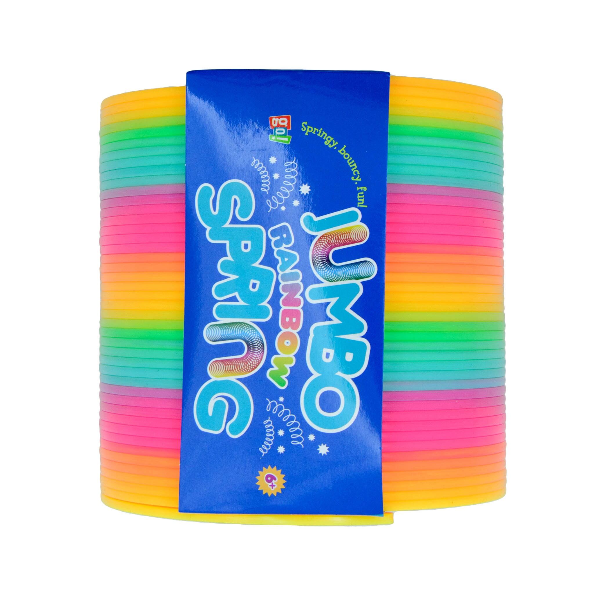 A packaged Jumbo Rainbow Spring toy featuring a colorful coiled spring design with a label showing the product name and rainbow colors.