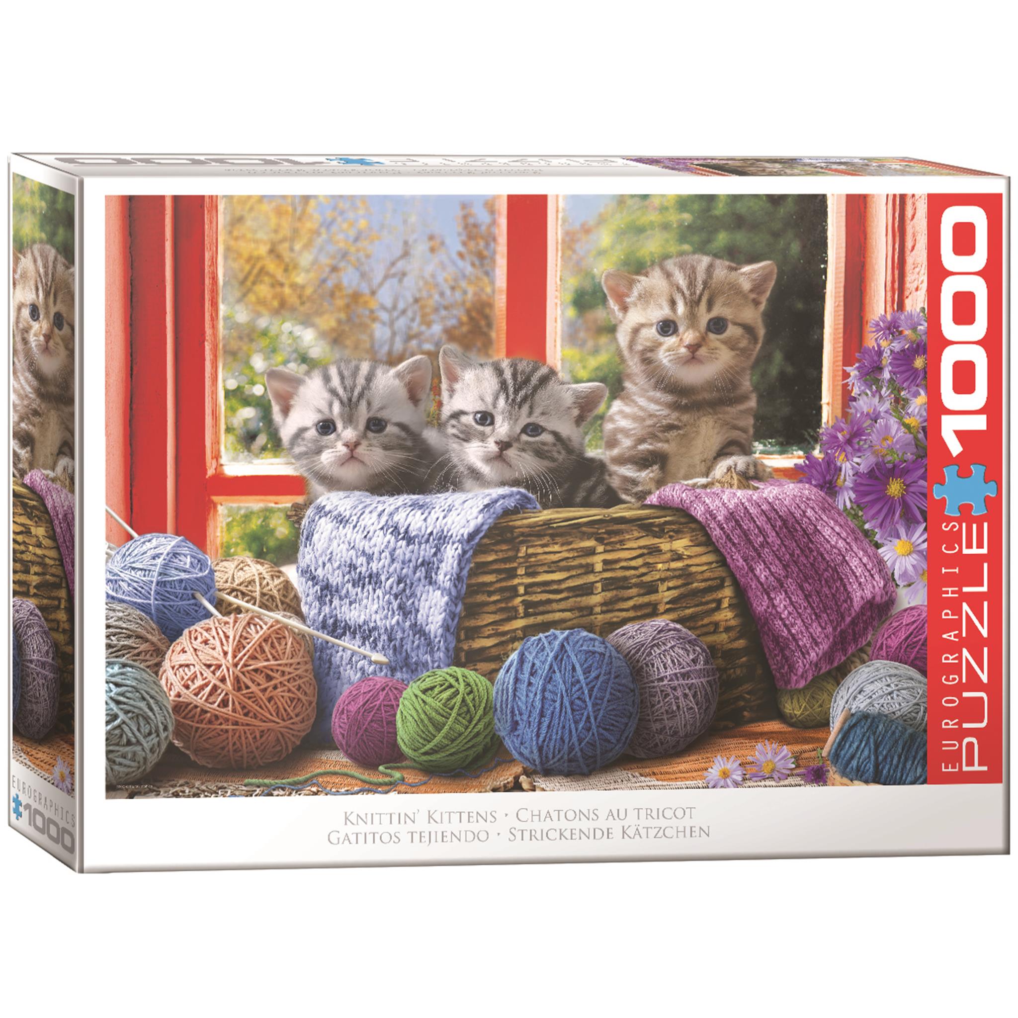 A 1000 piece jigsaw puzzle box featuring three kittens playfully exploring a basket with yarn balls.