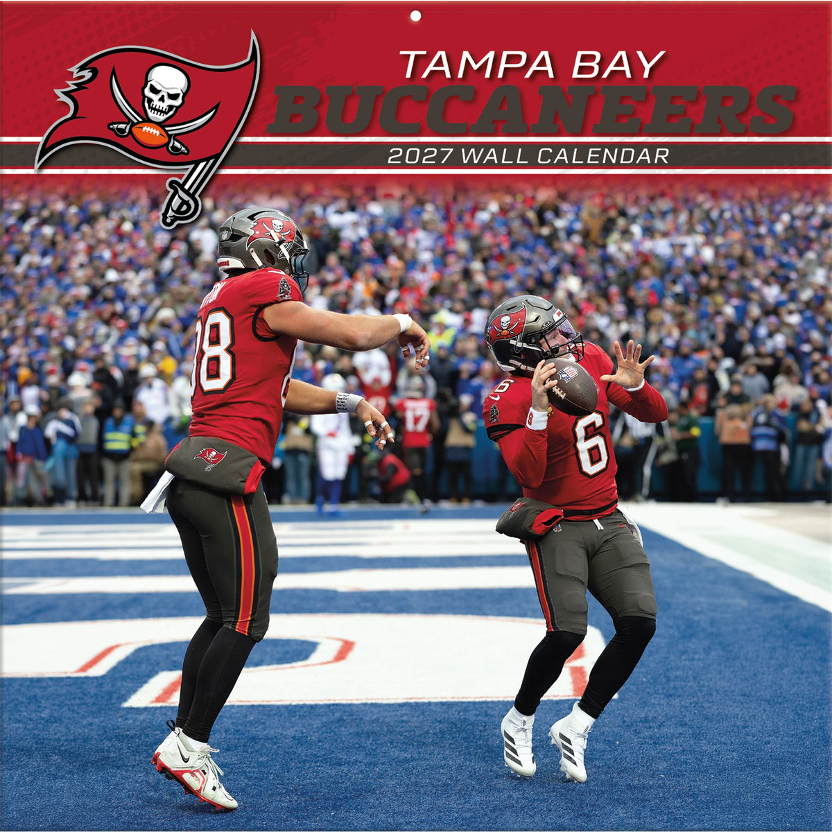 Tampa Bay Buccaneers 2027 wall calendar cover featuring two football players on a field with a crowded stadium background and the Buccaneers logo at the top.