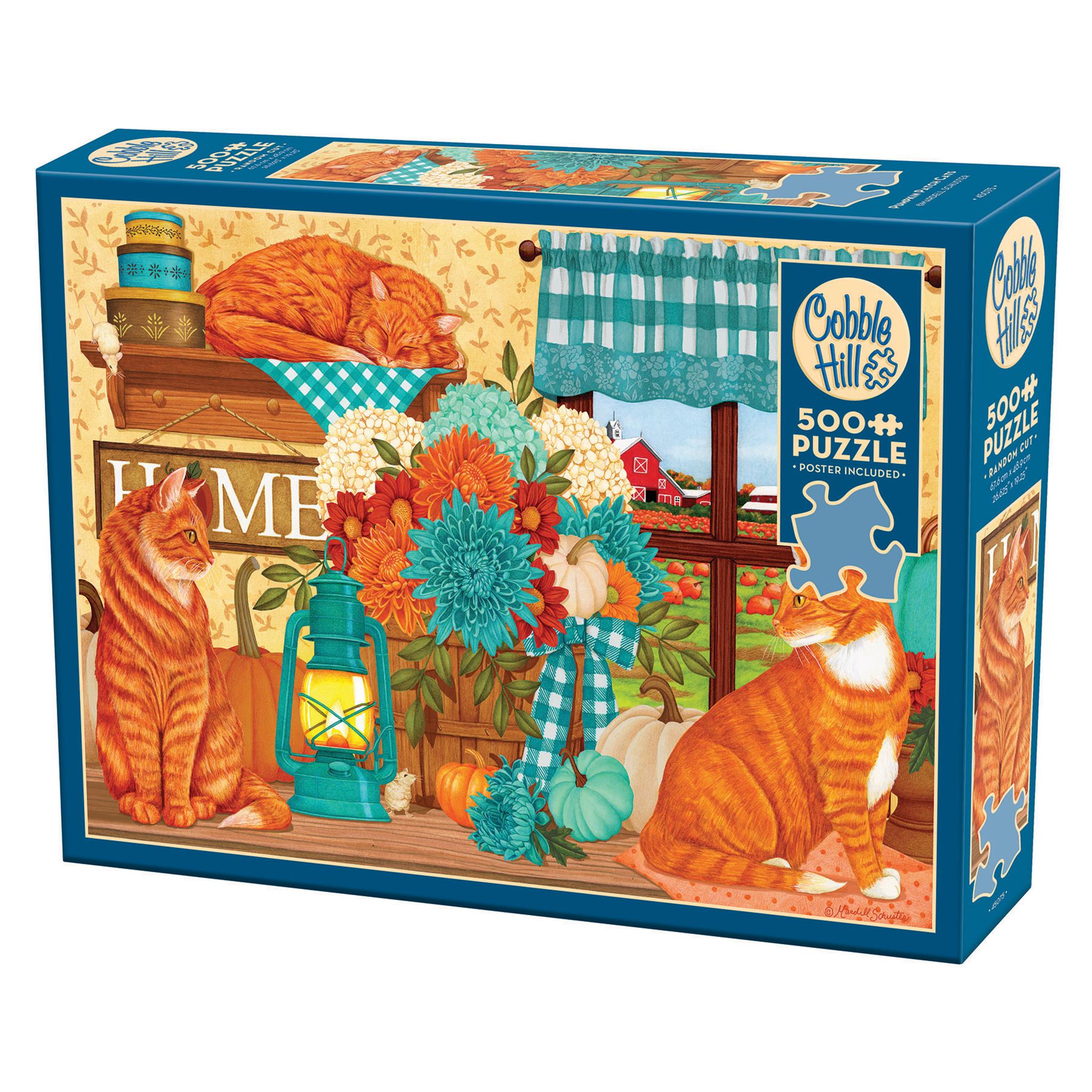 A 500 piece Cobble Hill jigsaw puzzle box featuring an illustration of orange cats, flowers, and pumpkins with a 'Home' theme.