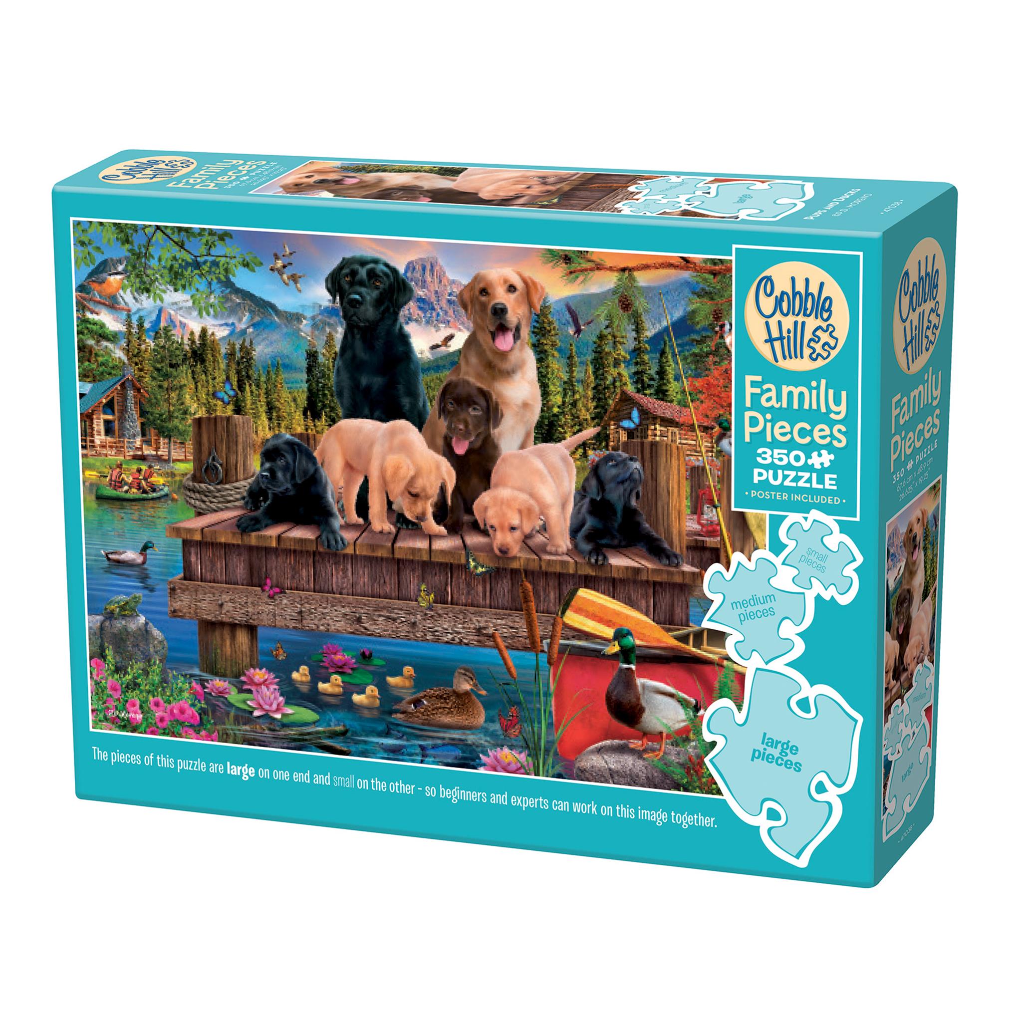 A puzzle box featuring an image of dogs and ducks on a wooden dock with a mountainous background. The box indicates it is a 350 piece family puzzle with both large and small pieces.
