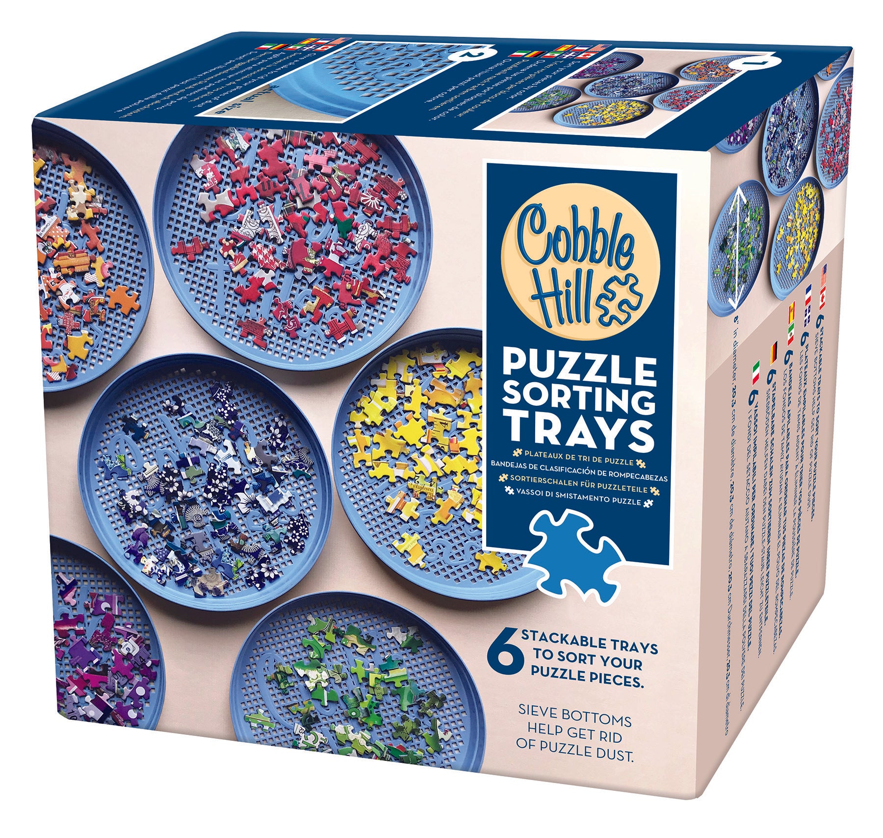 A set of six blue stackable sorting trays from Cobble Hill, designed for organizing puzzle pieces. The product is packaged in a box showing the trays filled with various puzzle pieces and the product name.