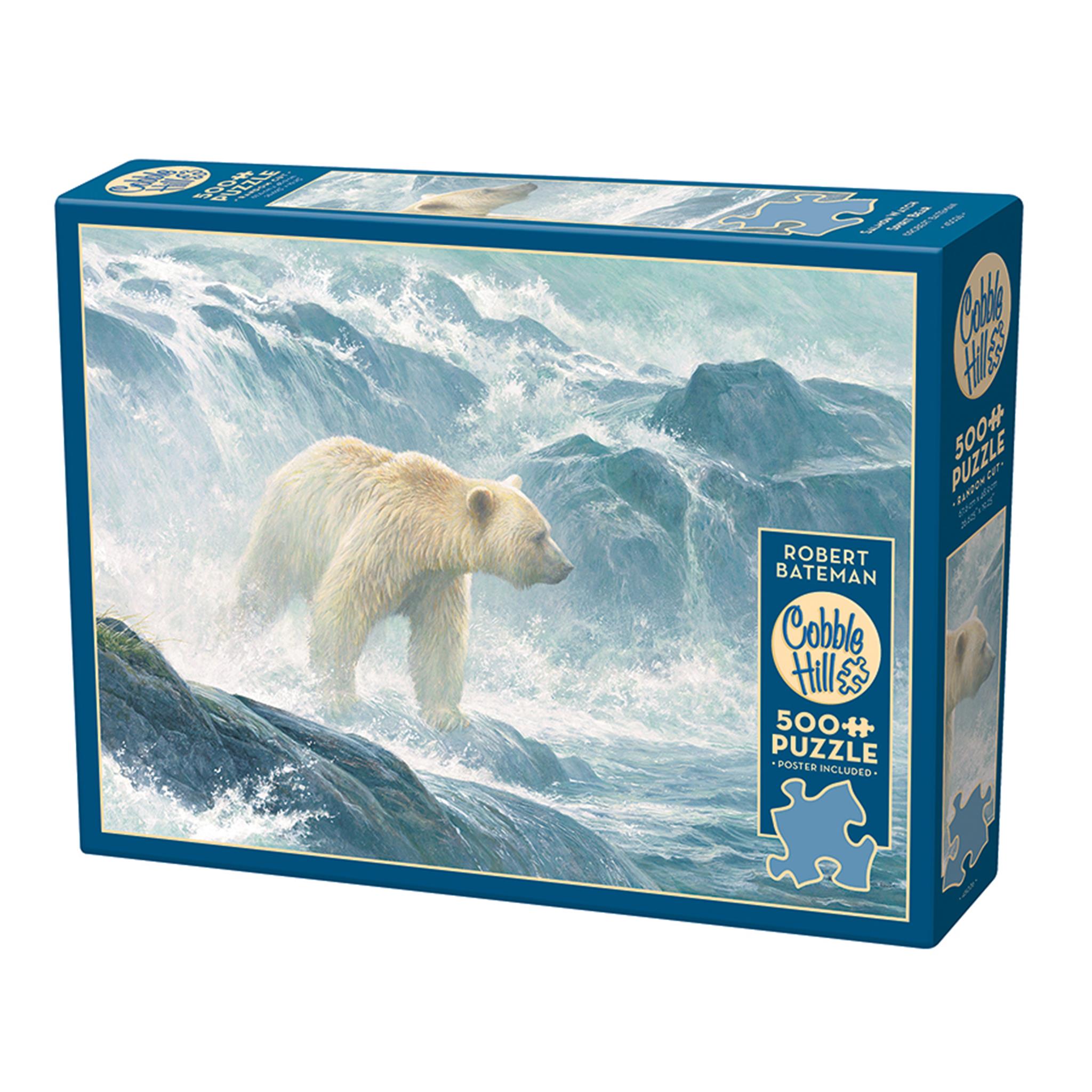 A 500 piece Cobble Hill jigsaw puzzle box featuring an artwork of a spirit bear (white-furred black bear) on a seashore with waves and rocks in the background.