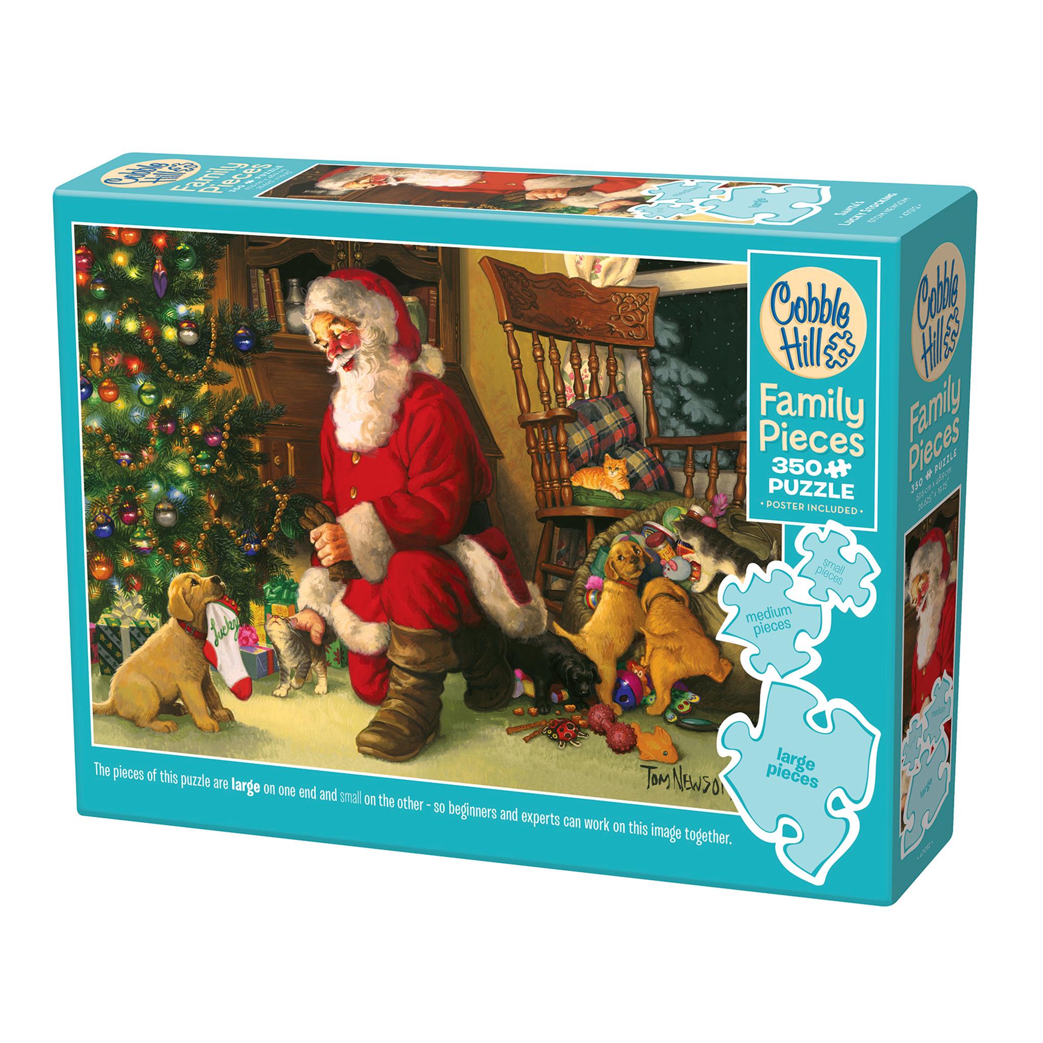A puzzle box featuring an illustration of Santa Claus sitting by a Christmas tree with two dogs, one on each side of Santa. The box indicates it is a 350 piece 'Family Pieces' puzzle by Cobble Hill.