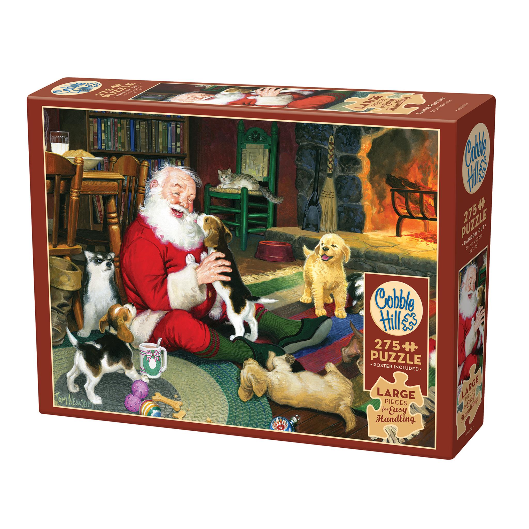 Santa on the floor of a rustic cabin playing with puppies while a fire burns in the background. Cobble Hill branded with Large Pieces for Easy Handling is called out.