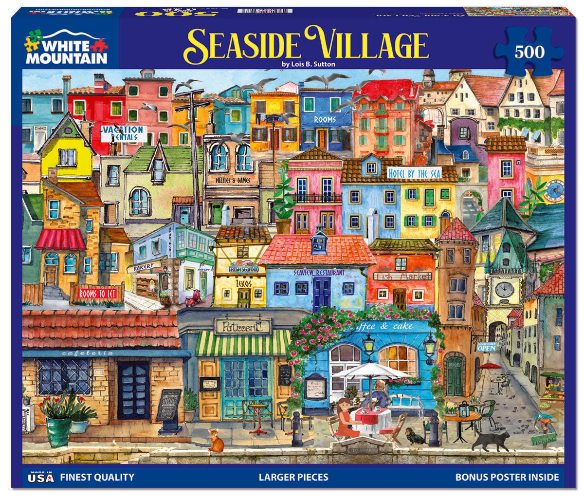 A 500-piece jigsaw puzzle depicting a colorful seaside village scene with various buildings, a pier, and a cat.