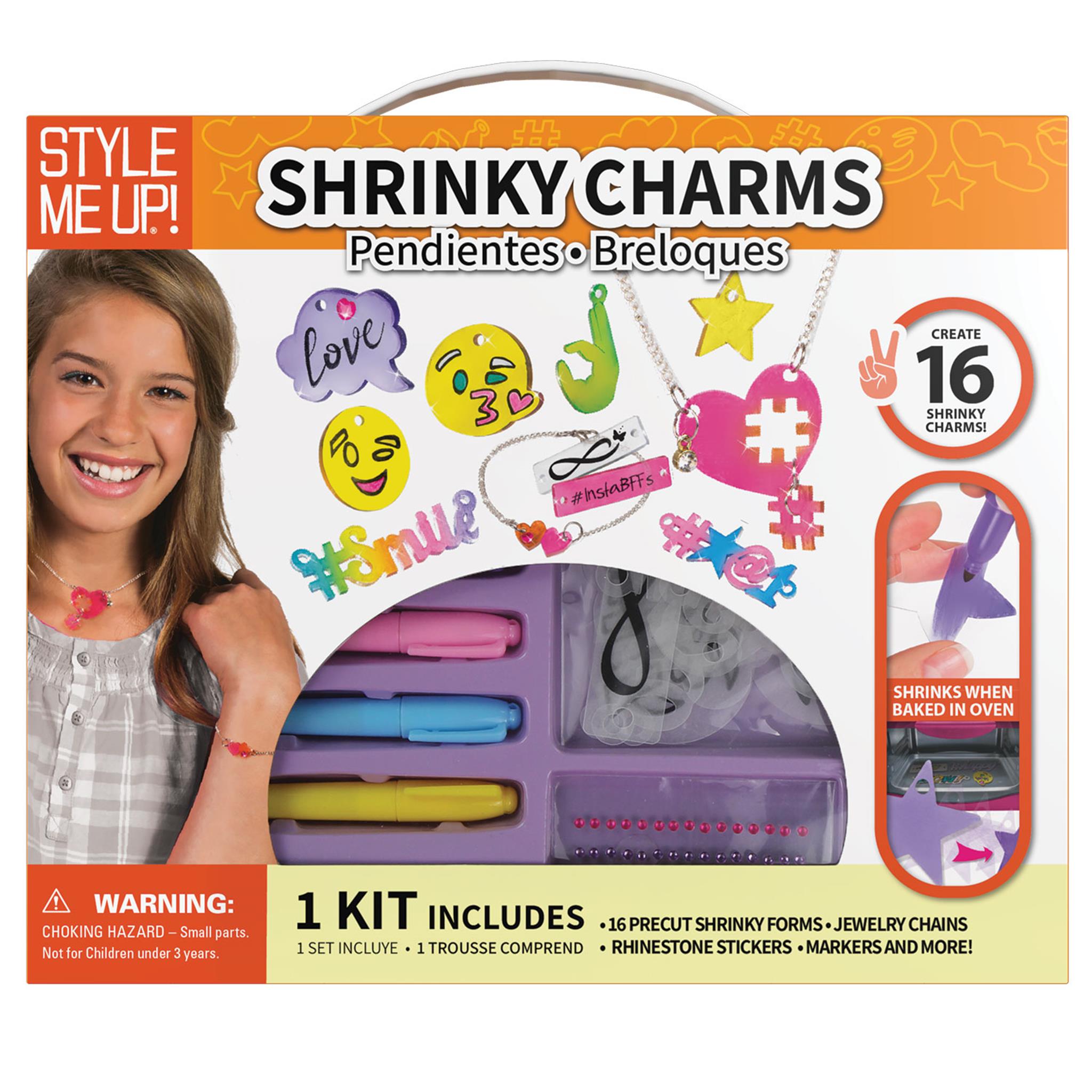 Packaging for Shrinky Charms craft kit with various colored charms and a smiling child wearing a charm bracelet.
