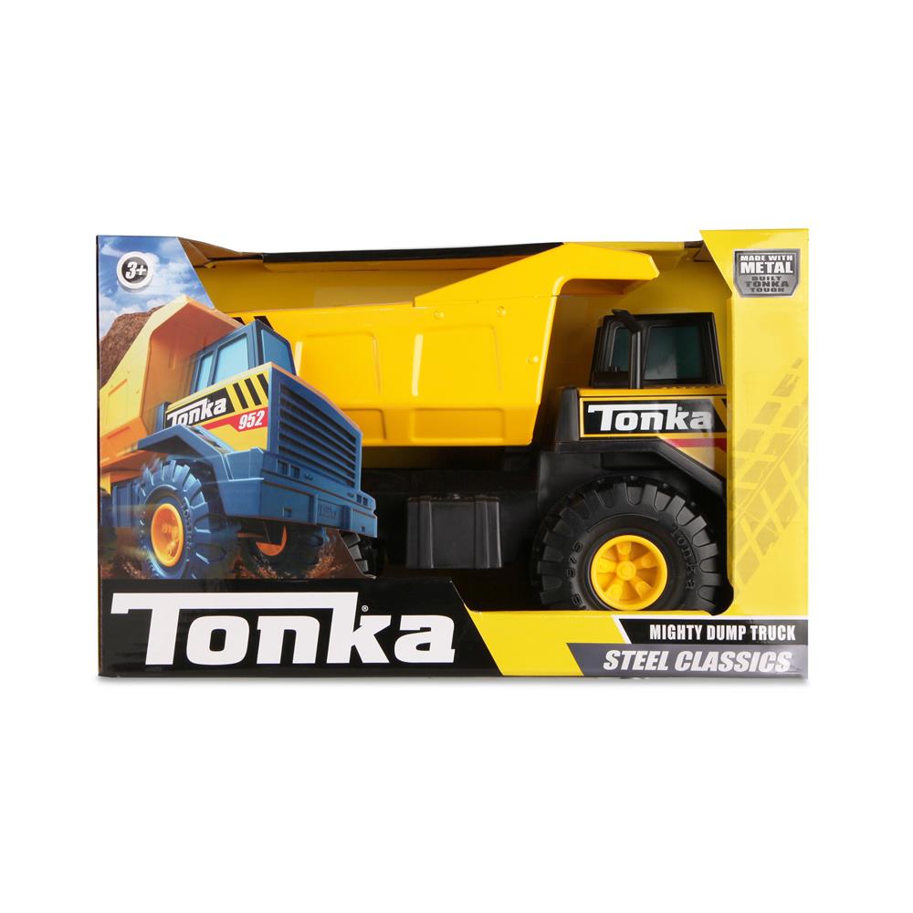 Tonka Steel Dump Truck toy in its packaging, featuring a yellow dump truck with black and blue accents. The product is labeled as a 'Steel Classic' and is designed for ages 3 and up.