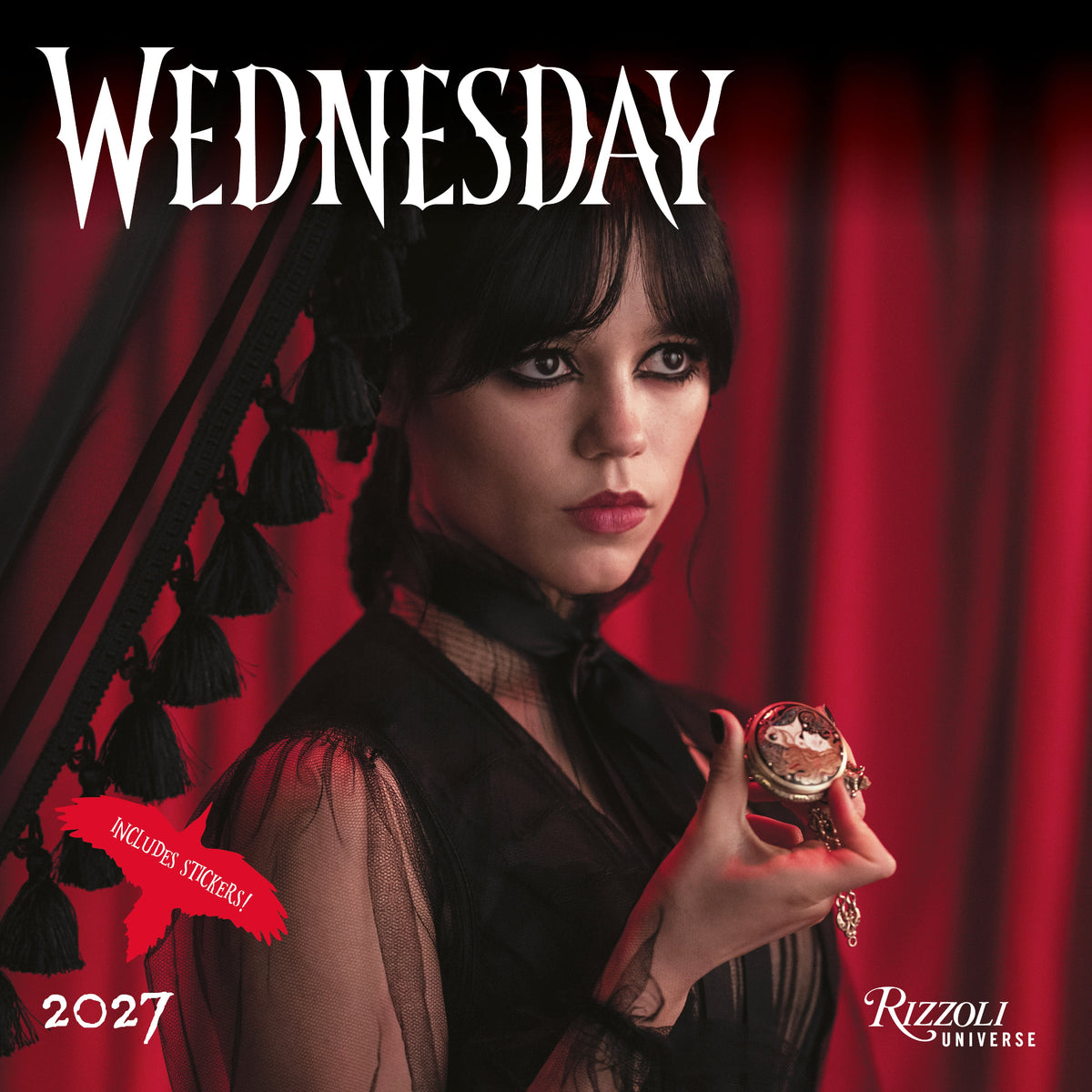 Rizzoli Universe Wednesday 2027 wall calendar cover featuring a gothic portrait of a woman with black hair and bangs, holding a small ornate object against a red curtain background, with the title 'WEDNESDAY' in large white letters and a pink 'INCLUDES STICKERS!' badge.