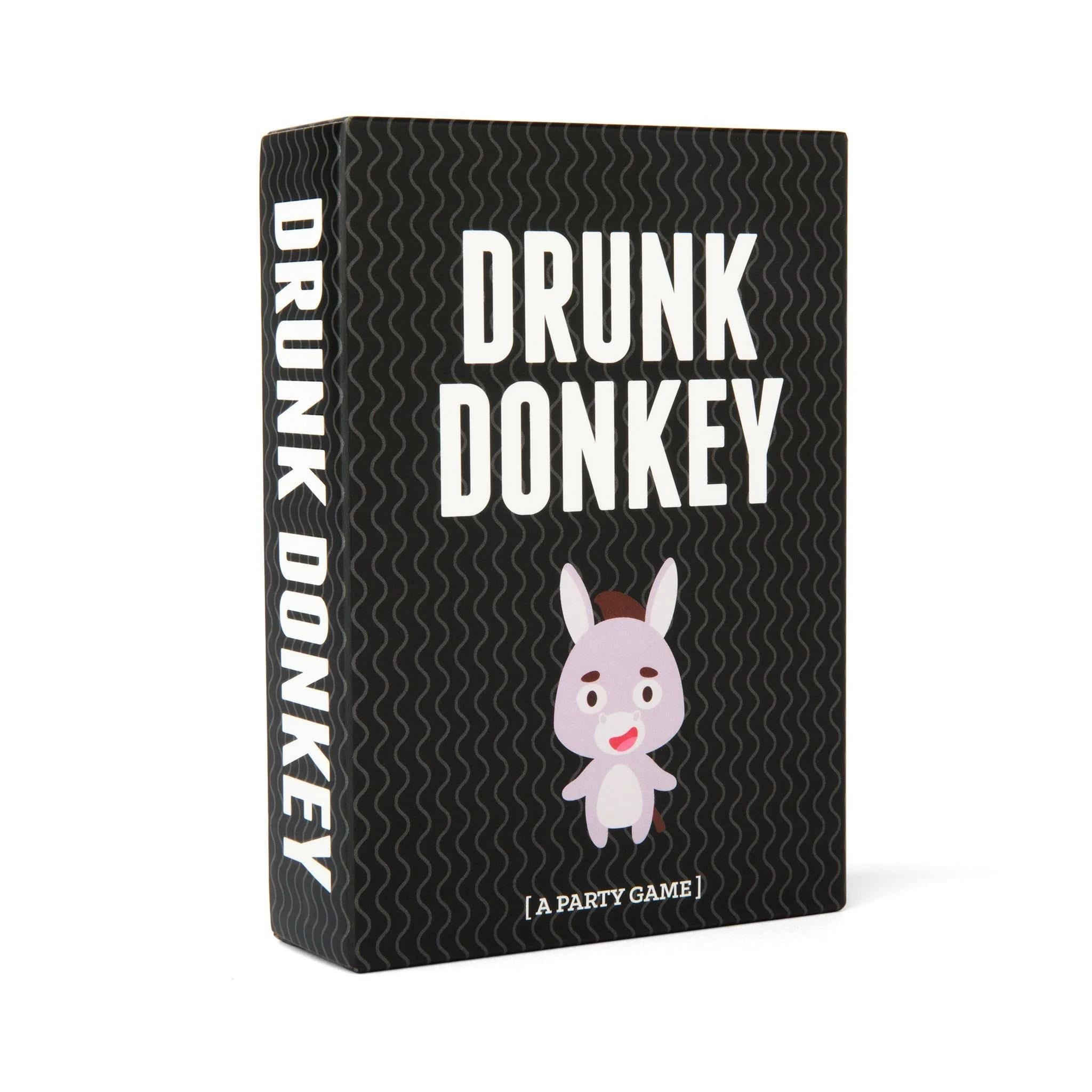 This image displays the packaging for the party game "Drunk Donkey." The box is sleek, with a bold black background featuring the name "DRUNK DONKEY" in white, stylized lettering above a playful cartoon illustration of a donkey.