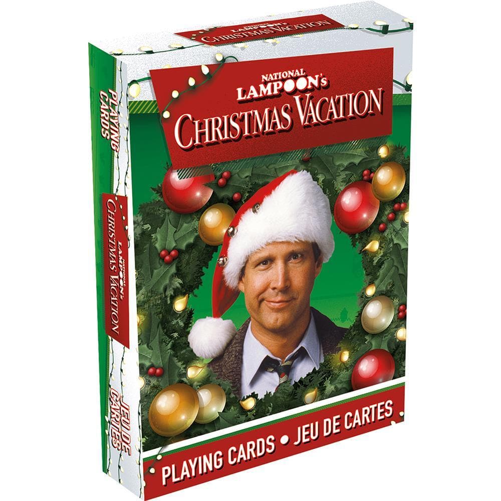 Deck of Christmas Vacation playing cards with a Clark wearing a Santa hat on the packaging, surrounded by holiday decorations.