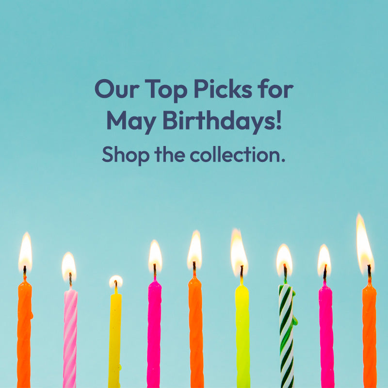 Colorful birthday candles on a blue background with text promoting 'Our Top Picks for May Birthdays! Shop the collection.'