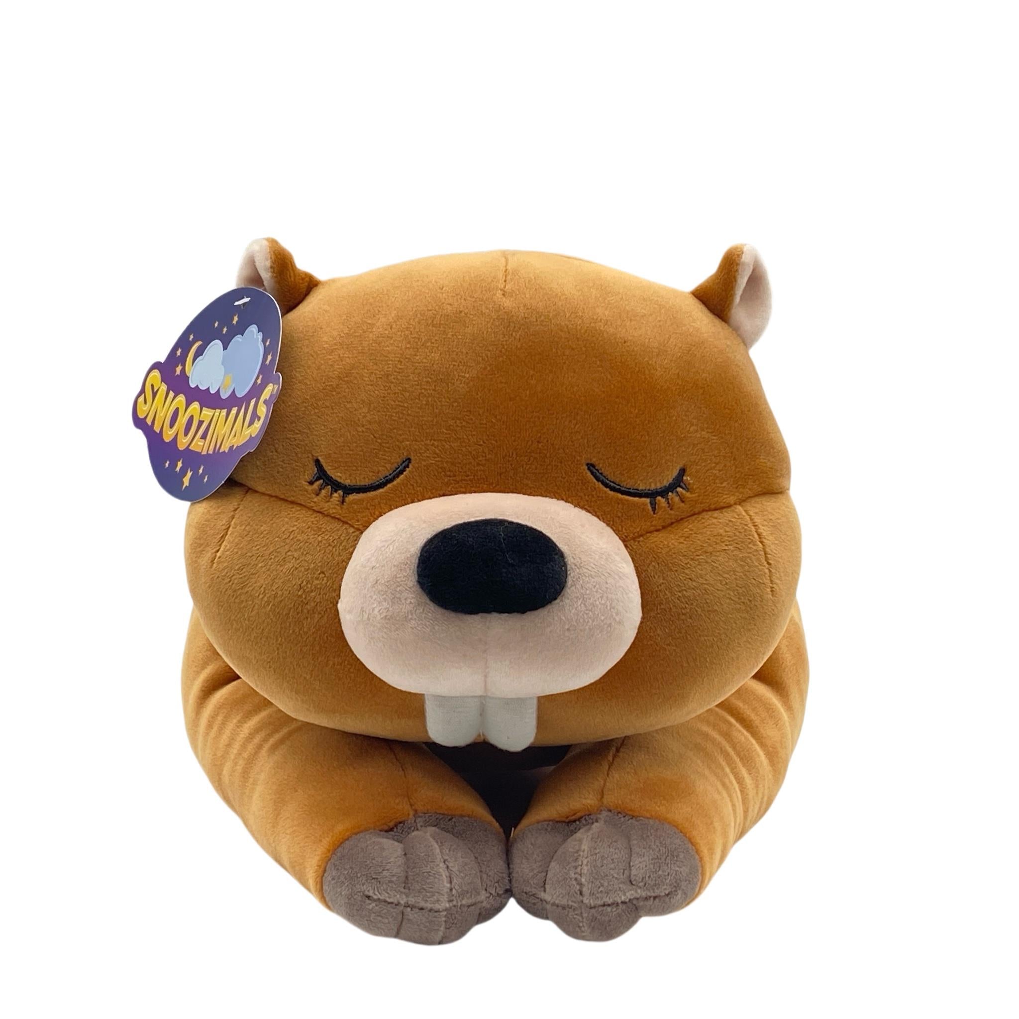 A plush toy resembling a beaver with a brown body, beige belly, and a content facial expression. With a Snoozimals branded tag attached to its ear.