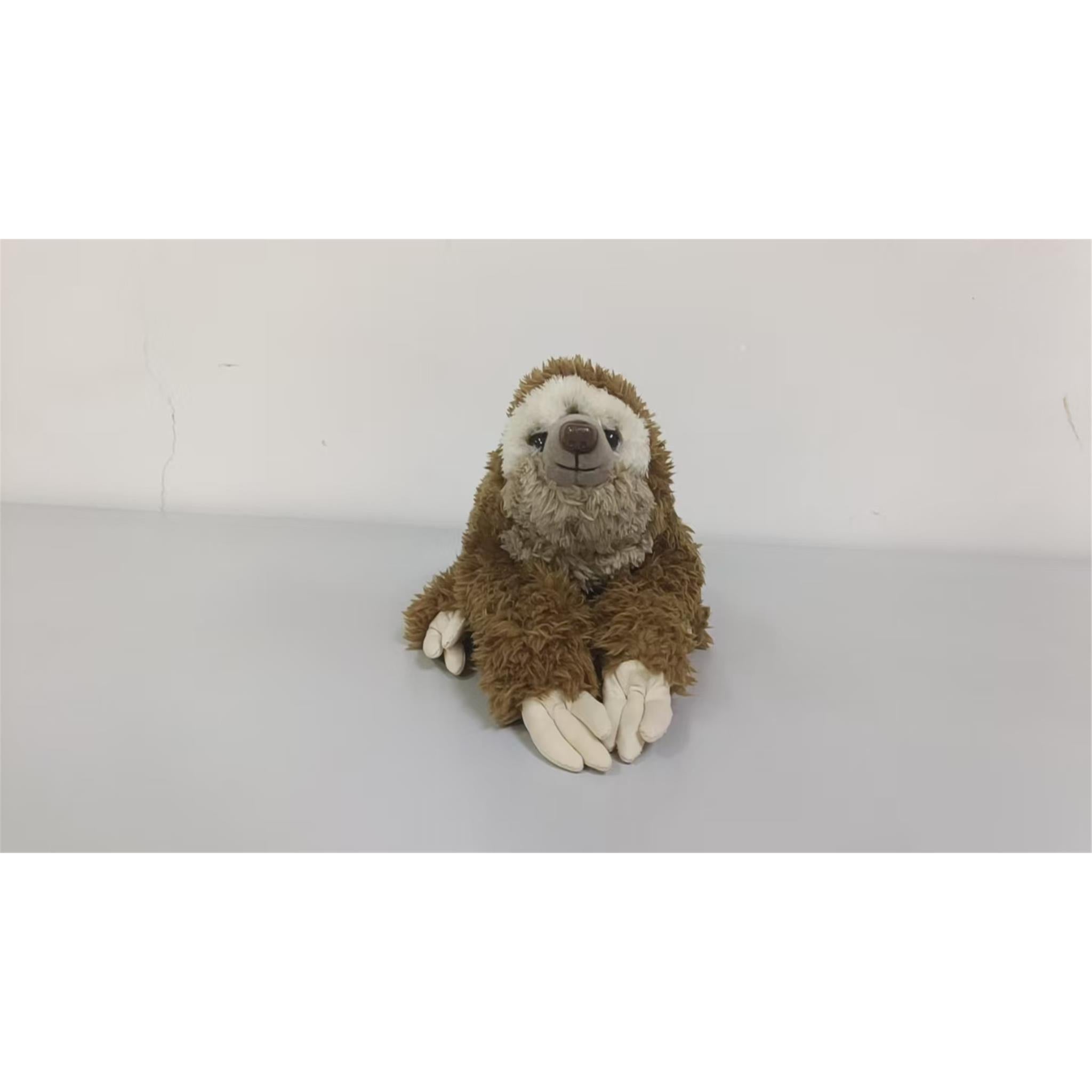 Scruffy and shaggy fur adorn this soft tri coloured sloth. Complete plastic eyes and nose while its stitched mouth portrays a sleepy and kind face
