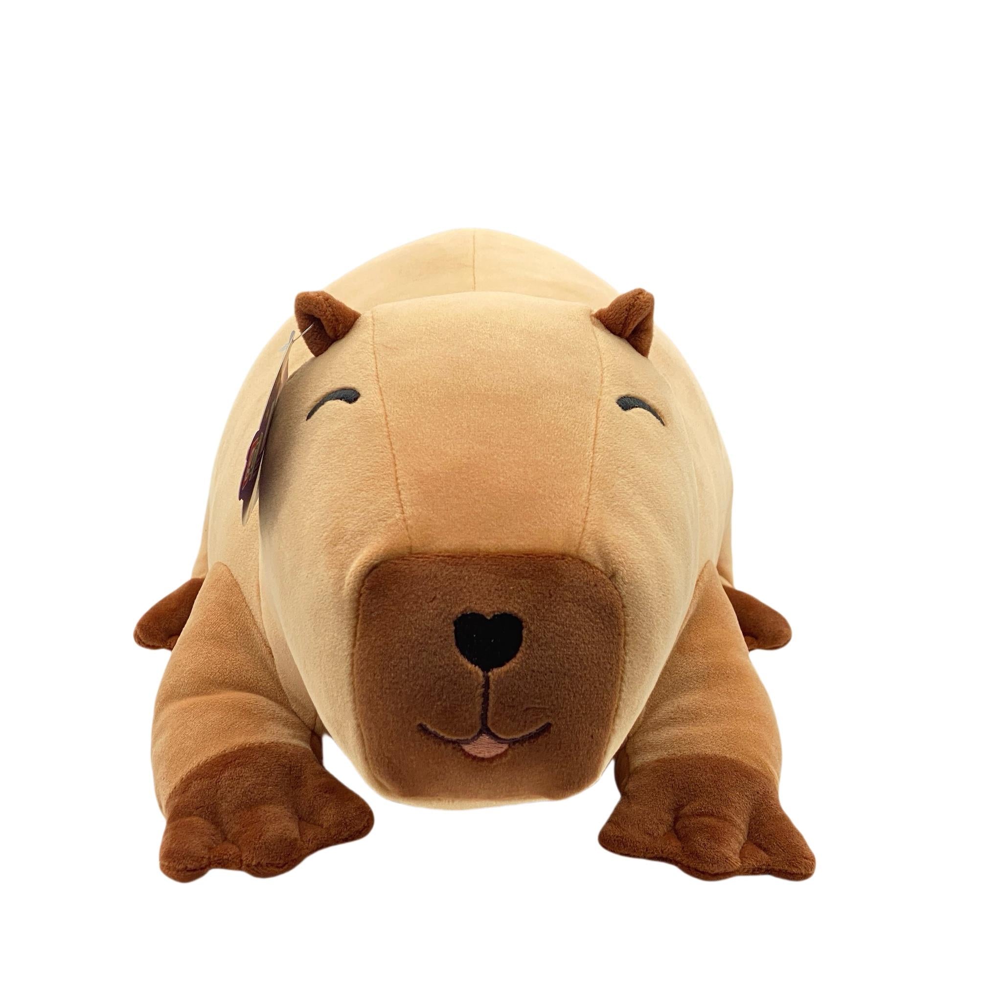 A plush toy resembling a brown capybara with a friendly facial expression.