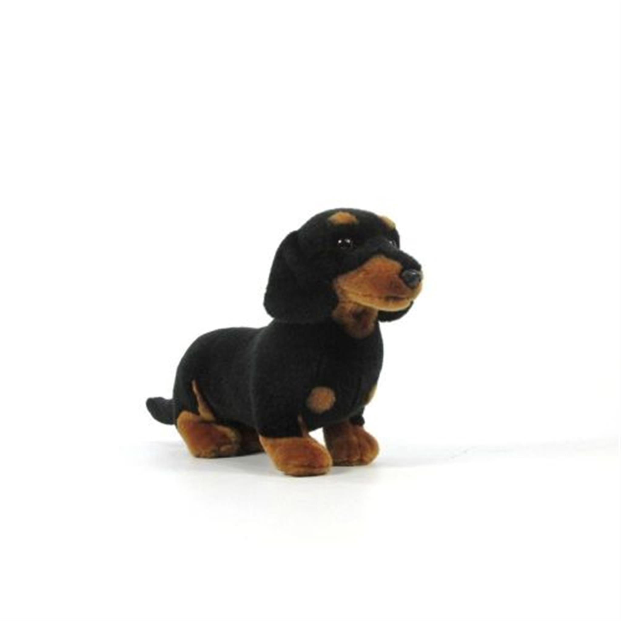 A plush toy resembling a black and tan Dachshund with a standing pose.