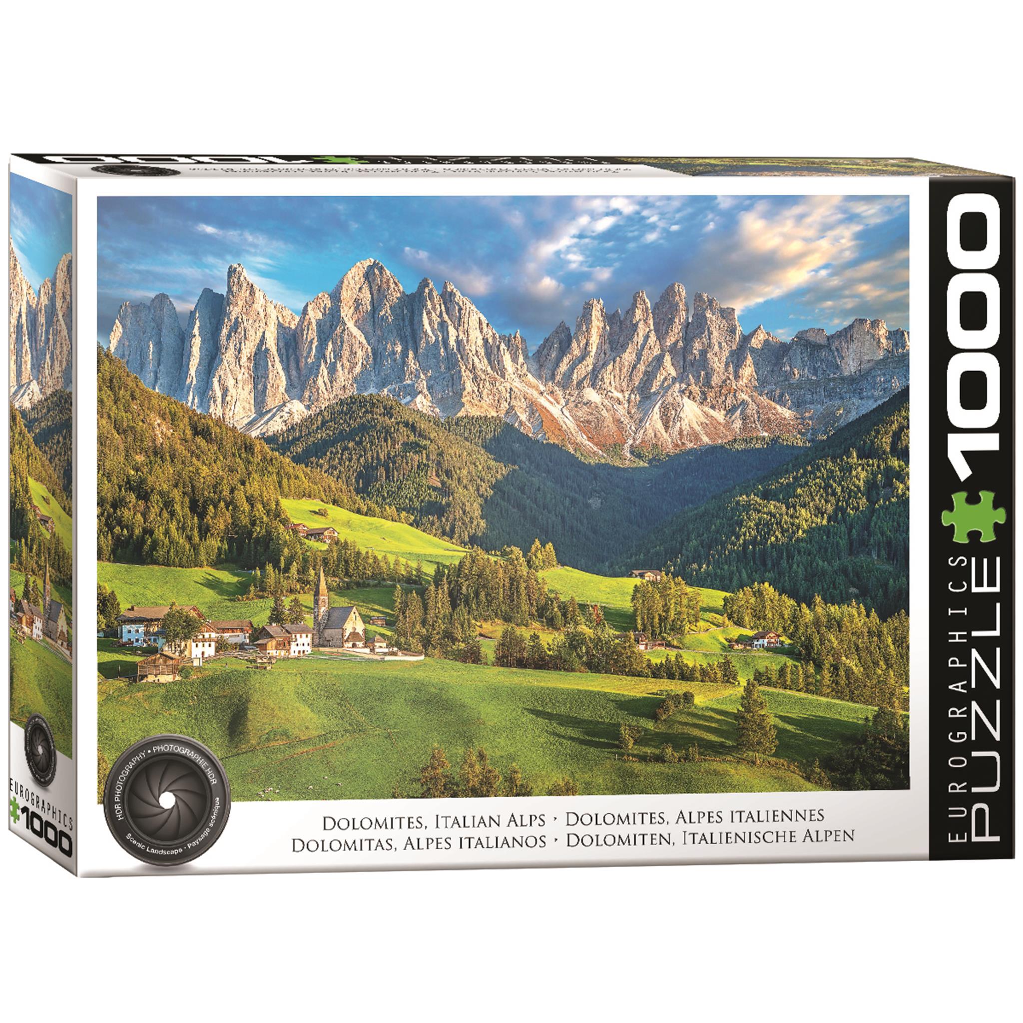A 1000 piece jigsaw puzzle box featuring a scenic view of the Dolomites Italian Alps with green fields and villages in the foreground.
