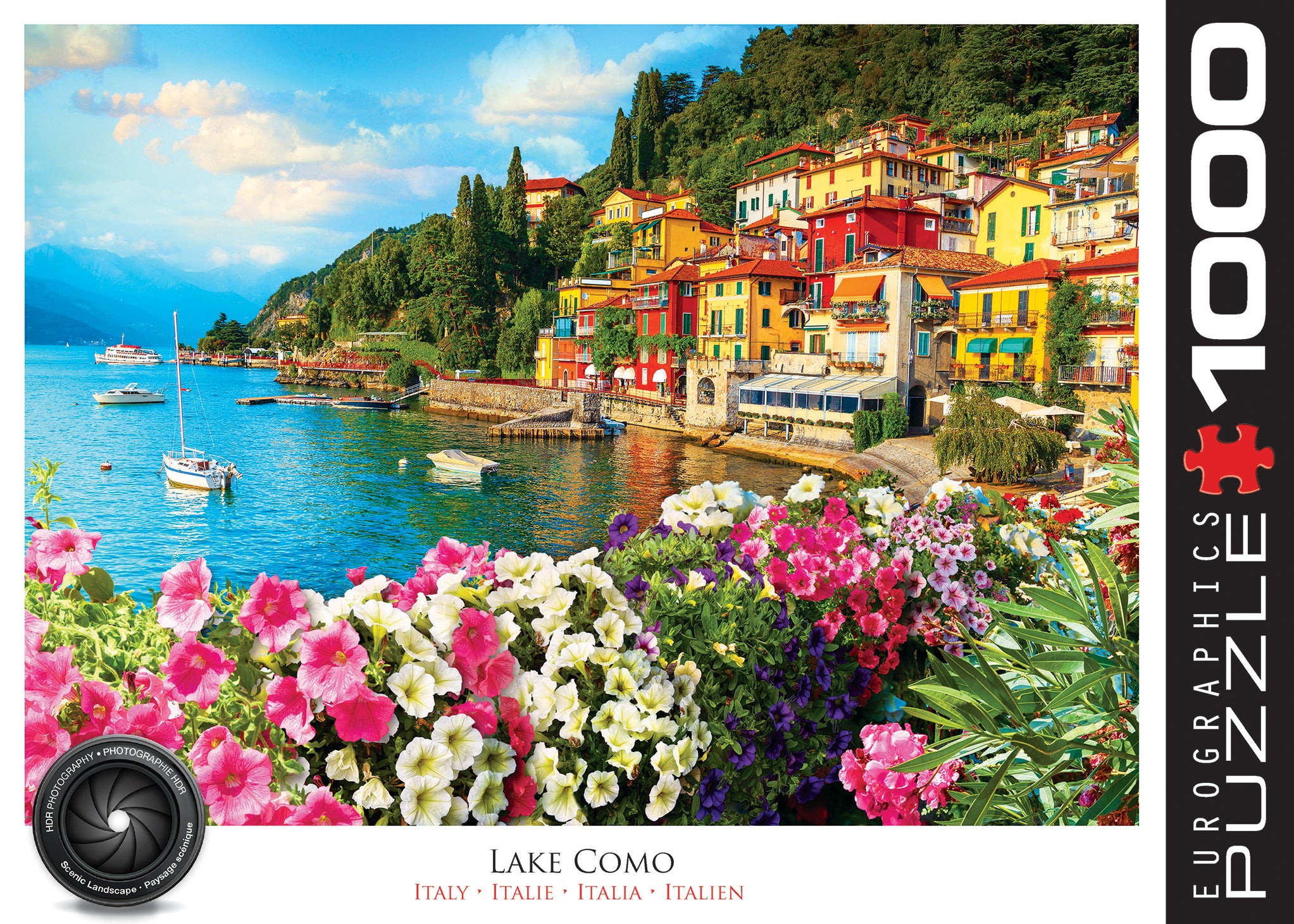 A 1000 piece jigsaw puzzle depicting a vibrant scene of Lake Como, Italy with a colorful town on the shore and a boat in the foreground.