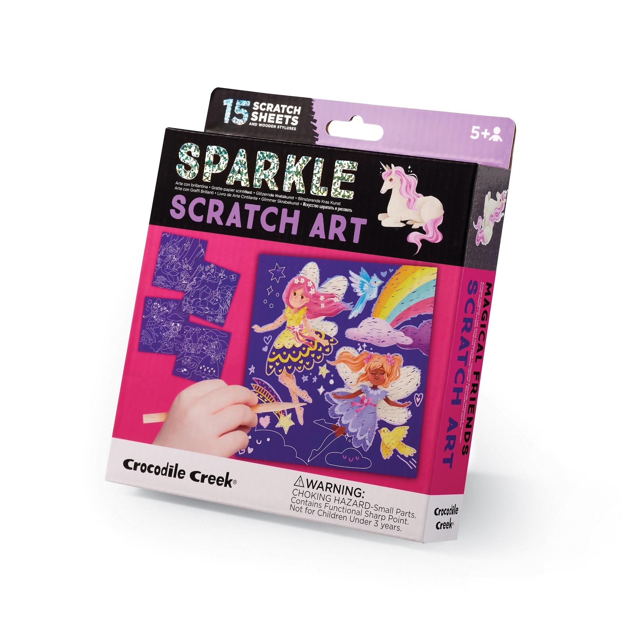 Packaging of 'Sparkle Scratch Art' by Crocodile Creek featuring illustrations of fairies and magical creatures, with a child using a wooden stylus on a scratch art sheet.