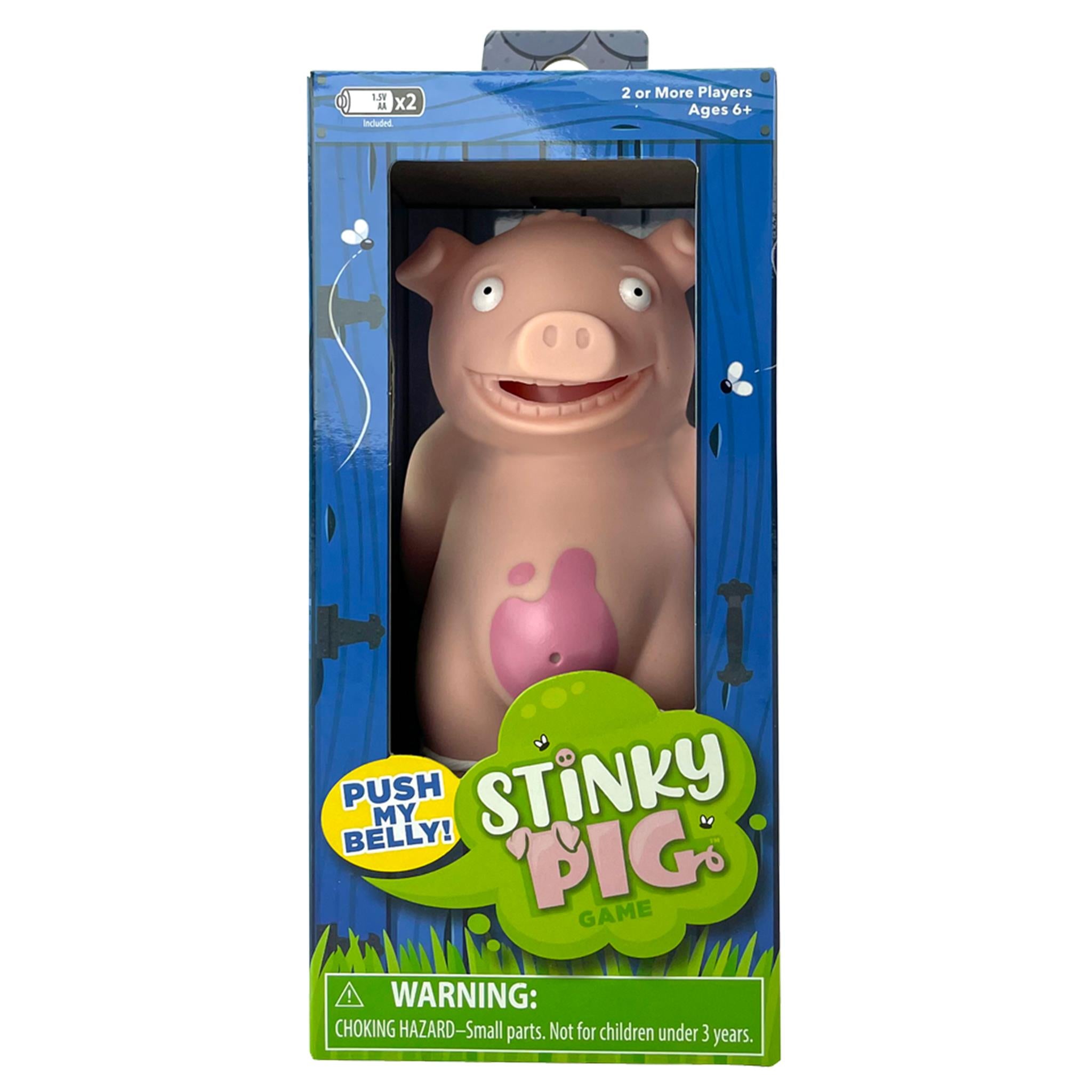 A toy pig in packaging, with a button on its belly, labeled 'Stinky Pig' with a warning about small parts not suitable for children under 3 years.