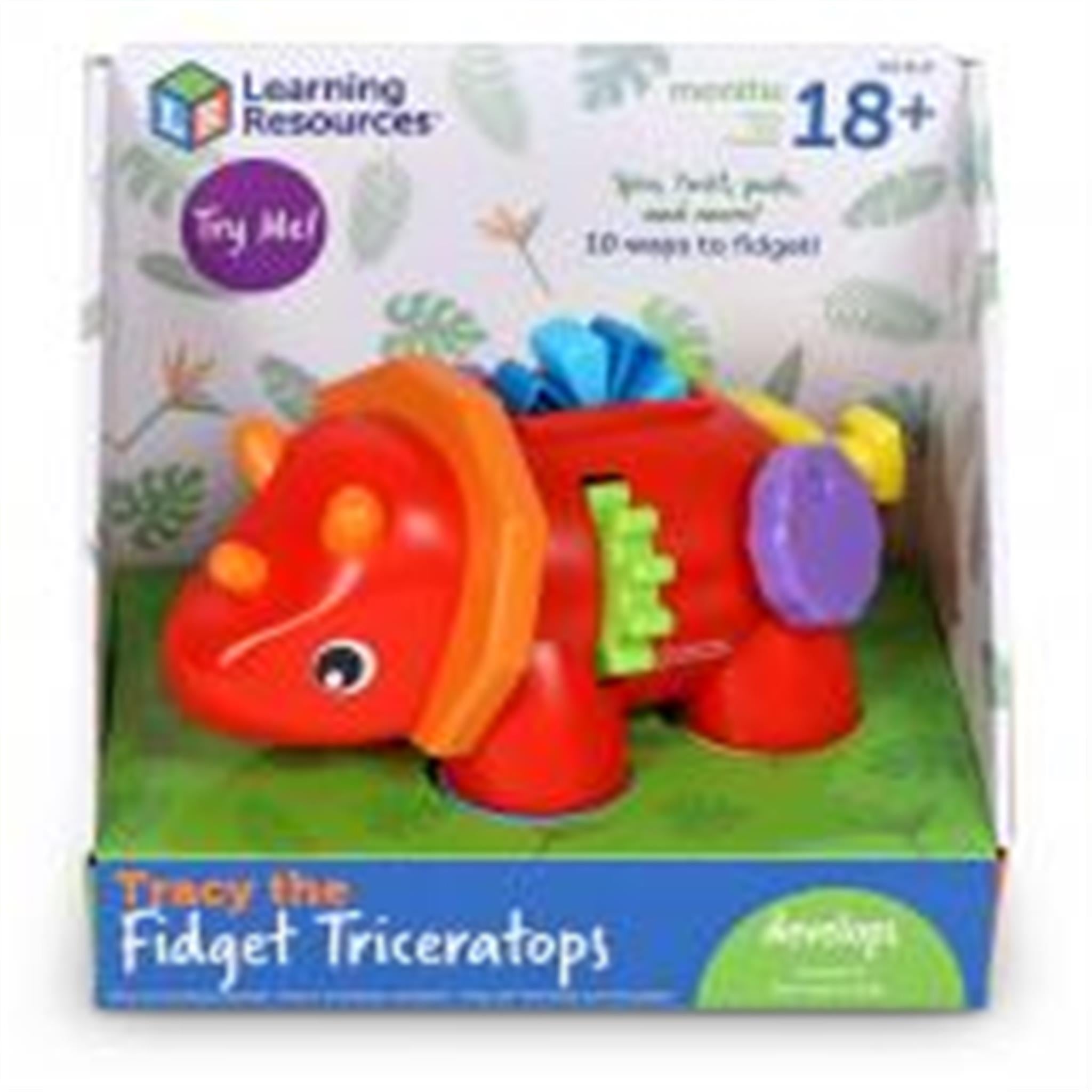 Packaged 'Tracy the Fidget Triceratops' toy featuring a colorful dinosaur with a wheel and lever on its back, displayed in its retail box.